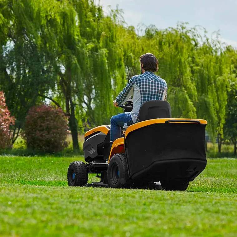 STIGA electric tractor on a green lawn seen from the side